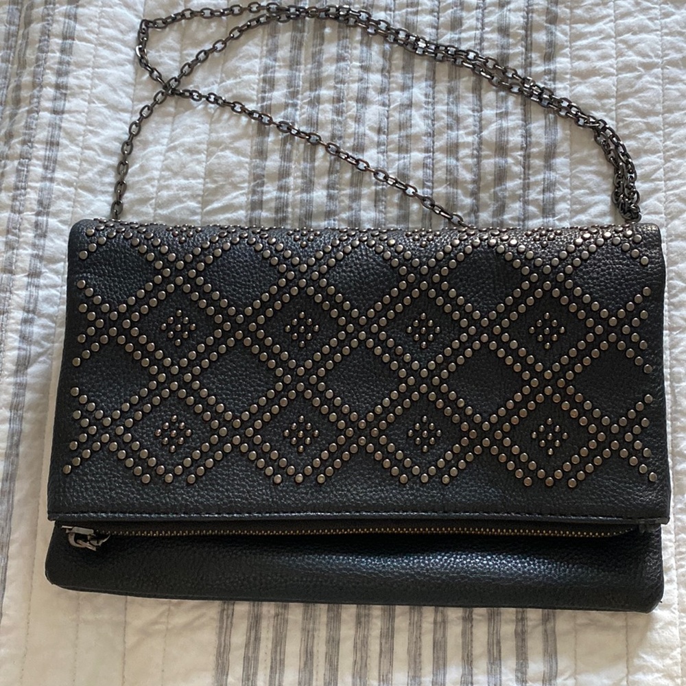 Black studded urban expressions over the shoulder bag. Zipper is a bit finicky